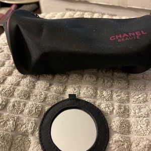 Chanel makeup bag with mirror.